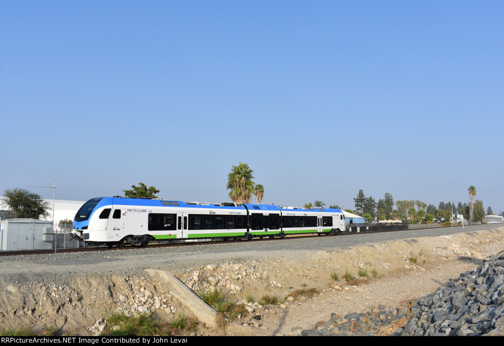 A San Bernardino-Downtown Station bound train approaches San Bernardino Tippercanoe Station 